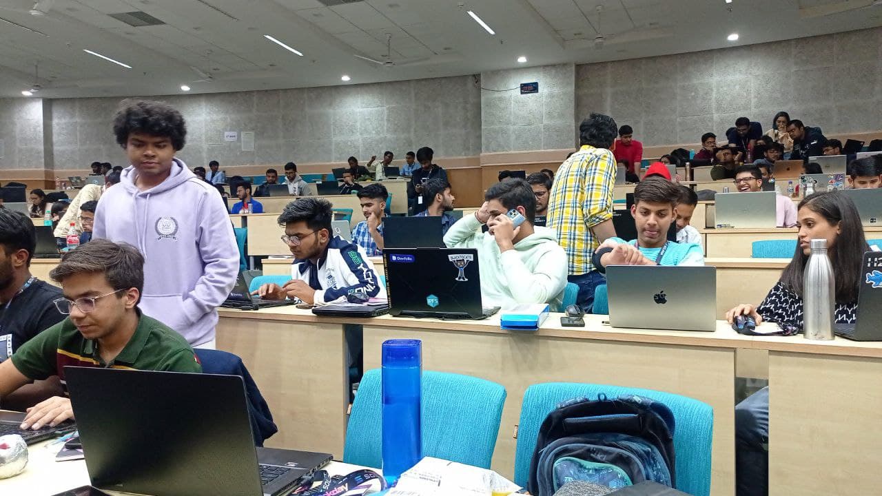 Hackers building together with laptops during Bhawna's first offline hackathon